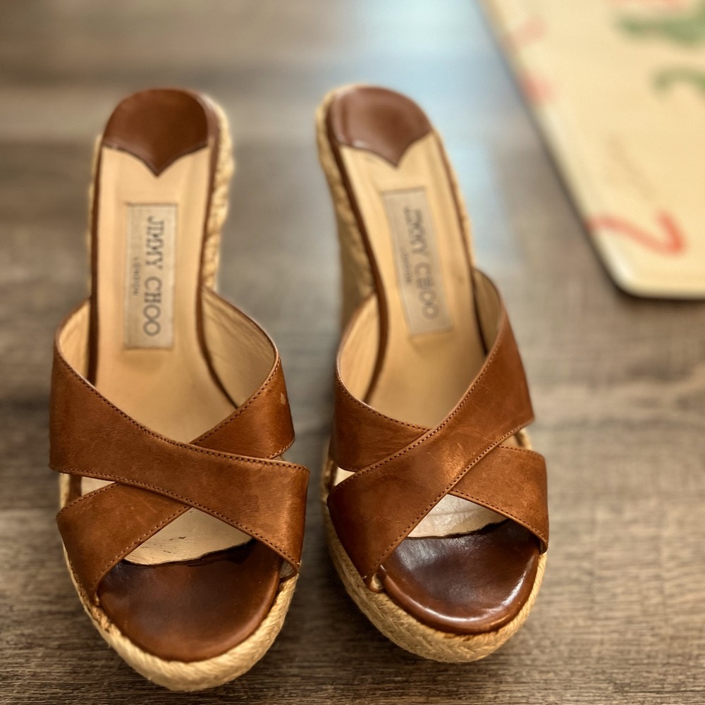 Jimmy Choo espadrilles with leather straps and raffia wedge and platform.